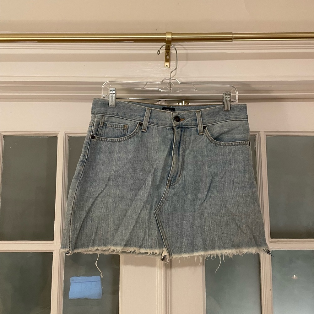 Distressed blue denim mini skirt